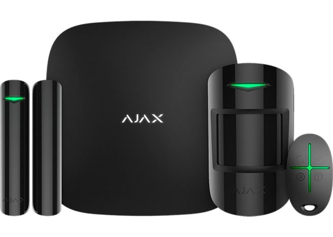 Ajax home security system kit with black hub, motion detector, two door/window sensors, and a remote control-the components arranged together for monitoring.
