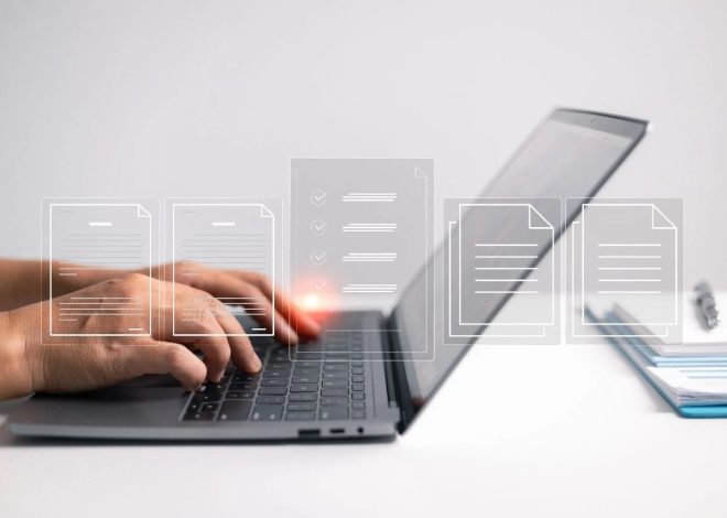 Hands typing on a laptop keyboard with translucent document icons floating above the device, suggesting digital files