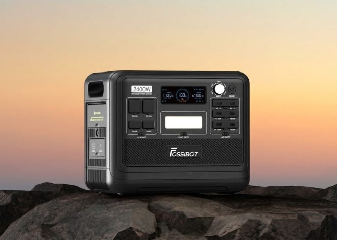 Portable power station on rocky surface at sunset, labeled FossiBot with 2400W capacity and multiple outlets on the front panel.